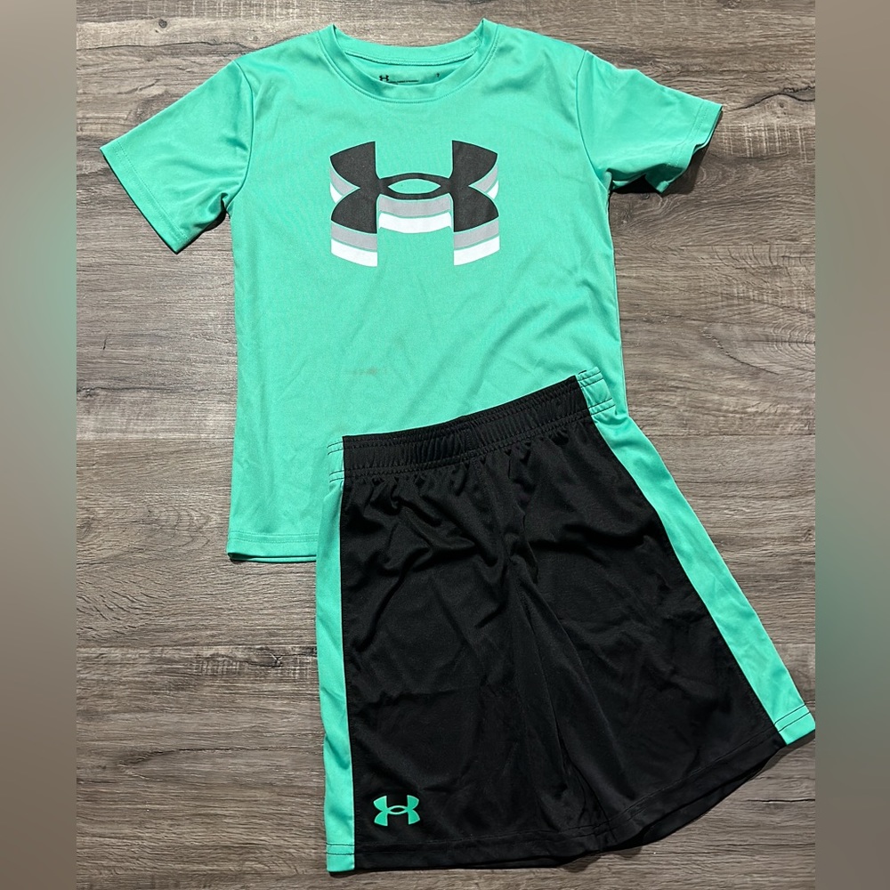 Boys set dryfit size 7. Small stain on shirt near waist.